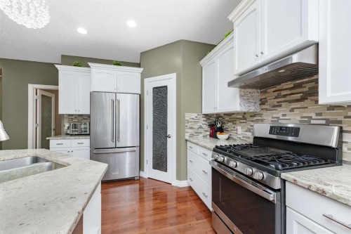 135 Kincora Drive Nw, Calgary, AB - Indoor Photo Showing Kitchen With Stainless Steel Kitchen With Double Sink With Upgraded Kitchen
