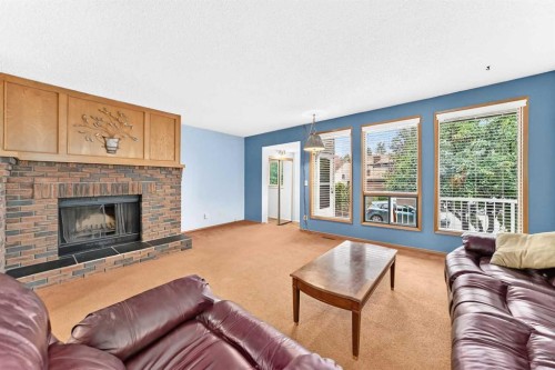 4008 46 Street Sw, Calgary, AB - Indoor Photo Showing Living Room With Fireplace