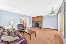 4008 46 Street Sw, Calgary, AB  - Indoor Photo Showing Living Room With Fireplace 