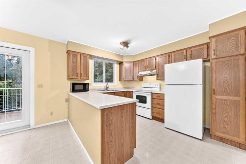 4008 46 Street Sw, Calgary, AB - Indoor Photo Showing Kitchen With Double Sink