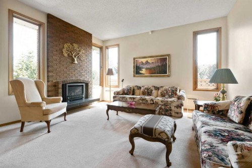 308 Canniff Place Sw, Calgary, AB - Indoor Photo Showing Living Room With Fireplace