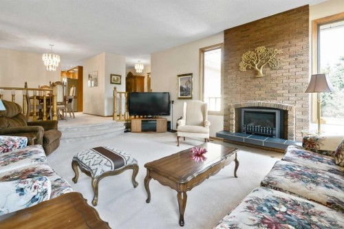 308 Canniff Place Sw, Calgary, AB - Indoor Photo Showing Living Room With Fireplace