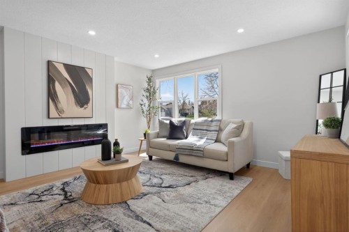 40 Bernard Way Nw, Calgary, AB - Indoor Photo Showing Living Room With Fireplace