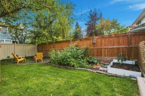 70 Sunset Way Se, Calgary, AB - Outdoor With Backyard