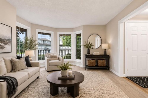 70 Sunset Way Se, Calgary, AB - Indoor Photo Showing Living Room