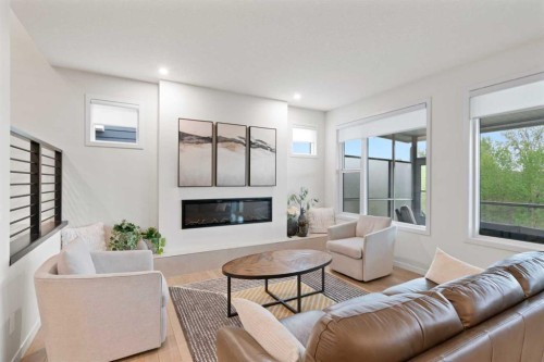 500 Cranbrook Gardens Se, Calgary, AB - Indoor Photo Showing Living Room With Fireplace