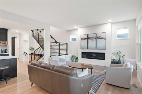 500 Cranbrook Gardens Se, Calgary, AB - Indoor Photo Showing Living Room With Fireplace