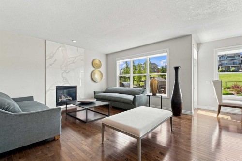 236 Hillcrest Drive Sw, Airdrie, AB - Indoor Photo Showing Living Room With Fireplace