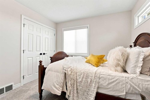 236 Hillcrest Drive Sw, Airdrie, AB - Indoor Photo Showing Bedroom