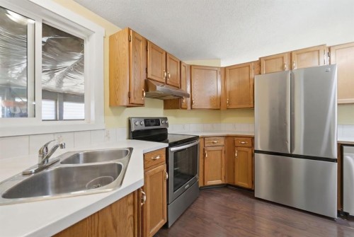 96 Falshire Close Ne, Calgary, AB - Indoor Photo Showing Kitchen With Double Sink