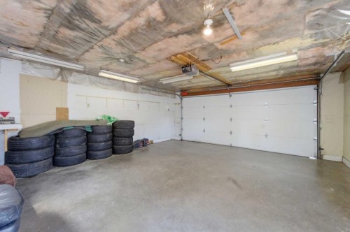 96 Falshire Close Ne, Calgary, AB - Indoor Photo Showing Garage