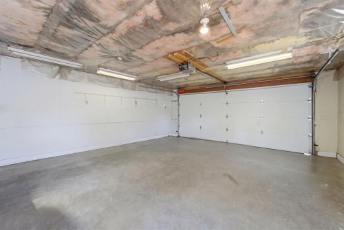 96 Falshire Close Ne, Calgary, AB - Indoor Photo Showing Garage