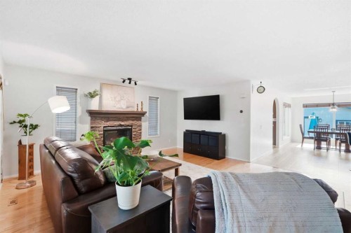 249 Inverness Park Se, Calgary, AB - Indoor Photo Showing Living Room With Fireplace