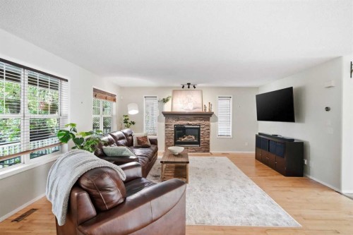 249 Inverness Park Se, Calgary, AB - Indoor Photo Showing Living Room With Fireplace