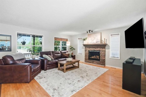 249 Inverness Park Se, Calgary, AB - Indoor Photo Showing Living Room With Fireplace