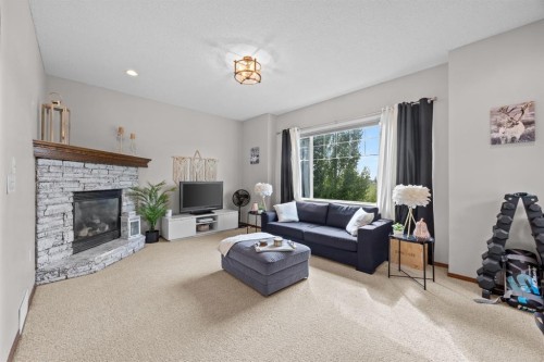 624 Cranston Drive Se, Calgary, AB - Indoor Photo Showing Living Room With Fireplace