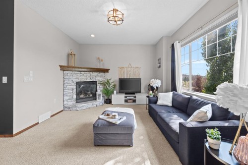 624 Cranston Drive Se, Calgary, AB - Indoor Photo Showing Living Room With Fireplace
