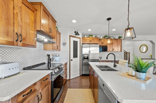 624 Cranston Drive Se, Calgary, AB - Indoor Photo Showing Kitchen With Double Sink With Upgraded Kitchen