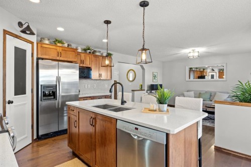 624 Cranston Drive Se, Calgary, AB - Indoor Photo Showing Kitchen With Double Sink With Upgraded Kitchen