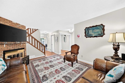617 Whitewood Road Ne, Calgary, AB - Indoor Photo Showing Living Room With Fireplace