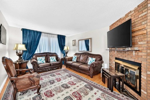 617 Whitewood Road Ne, Calgary, AB - Indoor Photo Showing Living Room With Fireplace