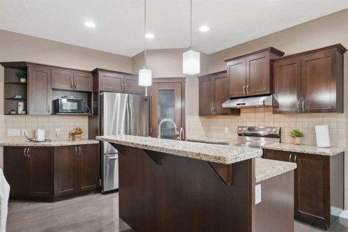509 New Brighton Drive Se, Calgary, AB - Indoor Photo Showing Kitchen With Stainless Steel Kitchen With Upgraded Kitchen