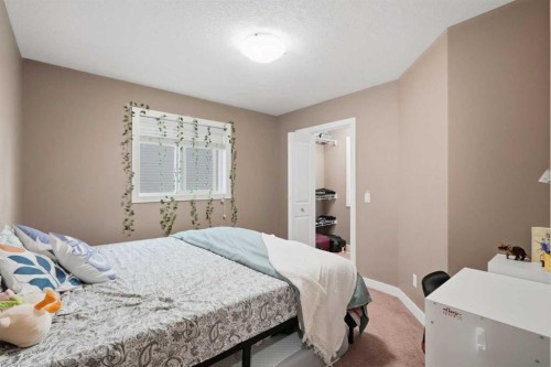 509 New Brighton Drive Se, Calgary, AB - Indoor Photo Showing Bedroom