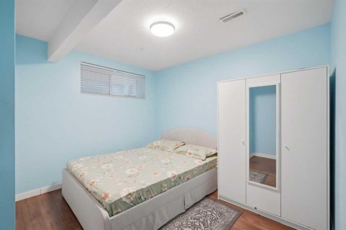 509 New Brighton Drive Se, Calgary, AB - Indoor Photo Showing Bedroom