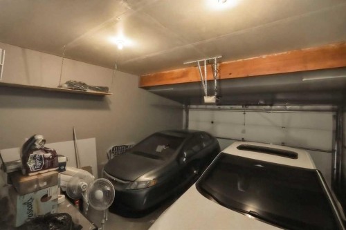 509 New Brighton Drive Se, Calgary, AB - Indoor Photo Showing Garage