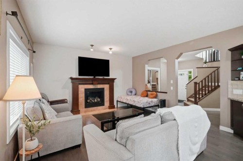 509 New Brighton Drive Se, Calgary, AB - Indoor Photo Showing Living Room With Fireplace
