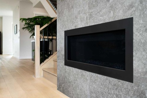 1141 Renfrew Drive Ne, Calgary, AB - Indoor Photo Showing Living Room With Fireplace