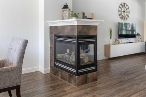 17 Auburn Bay View Se, Calgary, AB - Indoor Photo Showing Other Room With Fireplace