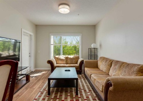 7-4 Sage Hill Terrace Nw, Calgary, AB - Indoor Photo Showing Living Room