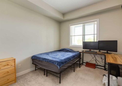 7-4 Sage Hill Terrace Nw, Calgary, AB - Indoor Photo Showing Bedroom