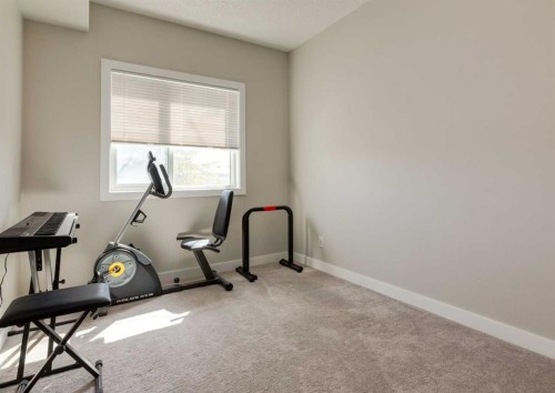 7-4 Sage Hill Terrace Nw, Calgary, AB - Indoor Photo Showing Gym Room