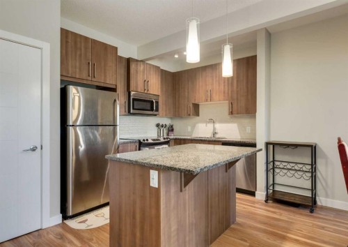 7-4 Sage Hill Terrace Nw, Calgary, AB - Indoor Photo Showing Kitchen With Stainless Steel Kitchen