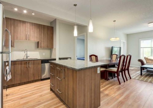 7-4 Sage Hill Terrace Nw, Calgary, AB - Indoor Photo Showing Kitchen With Stainless Steel Kitchen With Upgraded Kitchen