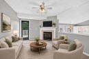 23 Sunlake Gardens Se, Calgary, AB  - Indoor Photo Showing Living Room With Fireplace 