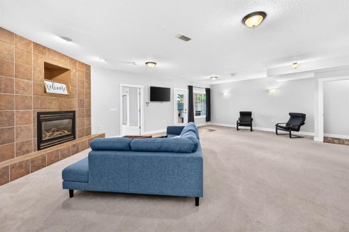 13 Cresthaven Way Sw, Calgary, AB - Indoor Photo Showing Living Room With Fireplace