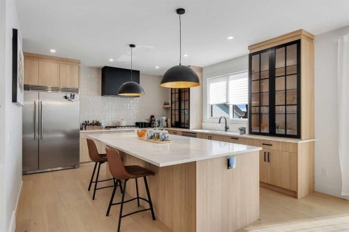 39 North Bridges Glen, Langdon, AB - Indoor Photo Showing Kitchen With Upgraded Kitchen