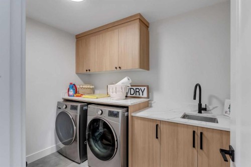 39 North Bridges Glen, Langdon, AB - Indoor Photo Showing Laundry Room