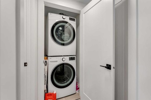 39 North Bridges Glen, Langdon, AB - Indoor Photo Showing Laundry Room