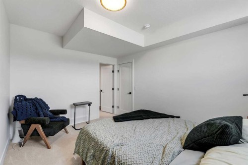 39 North Bridges Glen, Langdon, AB - Indoor Photo Showing Bedroom