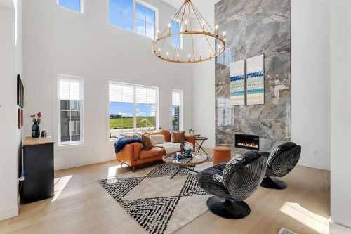 39 North Bridges Glen, Langdon, AB - Indoor Photo Showing Other Room With Fireplace