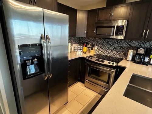 409-1320 1 Street Se, Calgary, AB - Indoor Photo Showing Kitchen With Upgraded Kitchen