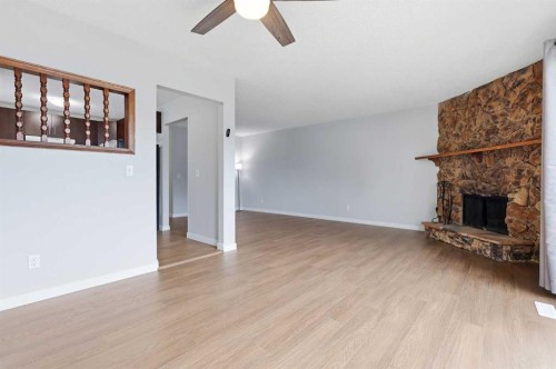15 Doverville Way Se, Calgary, AB - Indoor Photo Showing Other Room With Fireplace