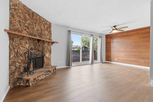 15 Doverville Way Se, Calgary, AB - Indoor Photo Showing Living Room With Fireplace