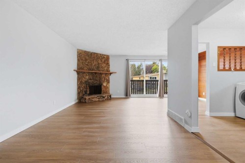 15 Doverville Way Se, Calgary, AB - Indoor Photo Showing Other Room With Fireplace