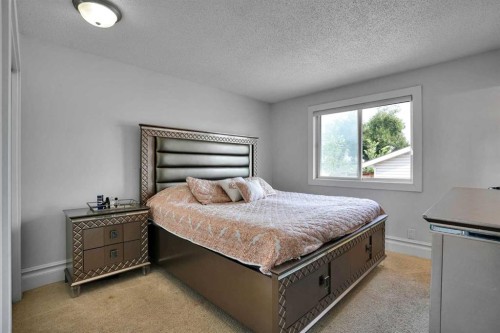 212 Pinetree Place Ne, Calgary, AB - Indoor Photo Showing Bedroom