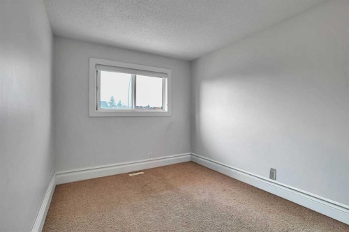 212 Pinetree Place Ne, Calgary, AB - Indoor Photo Showing Other Room